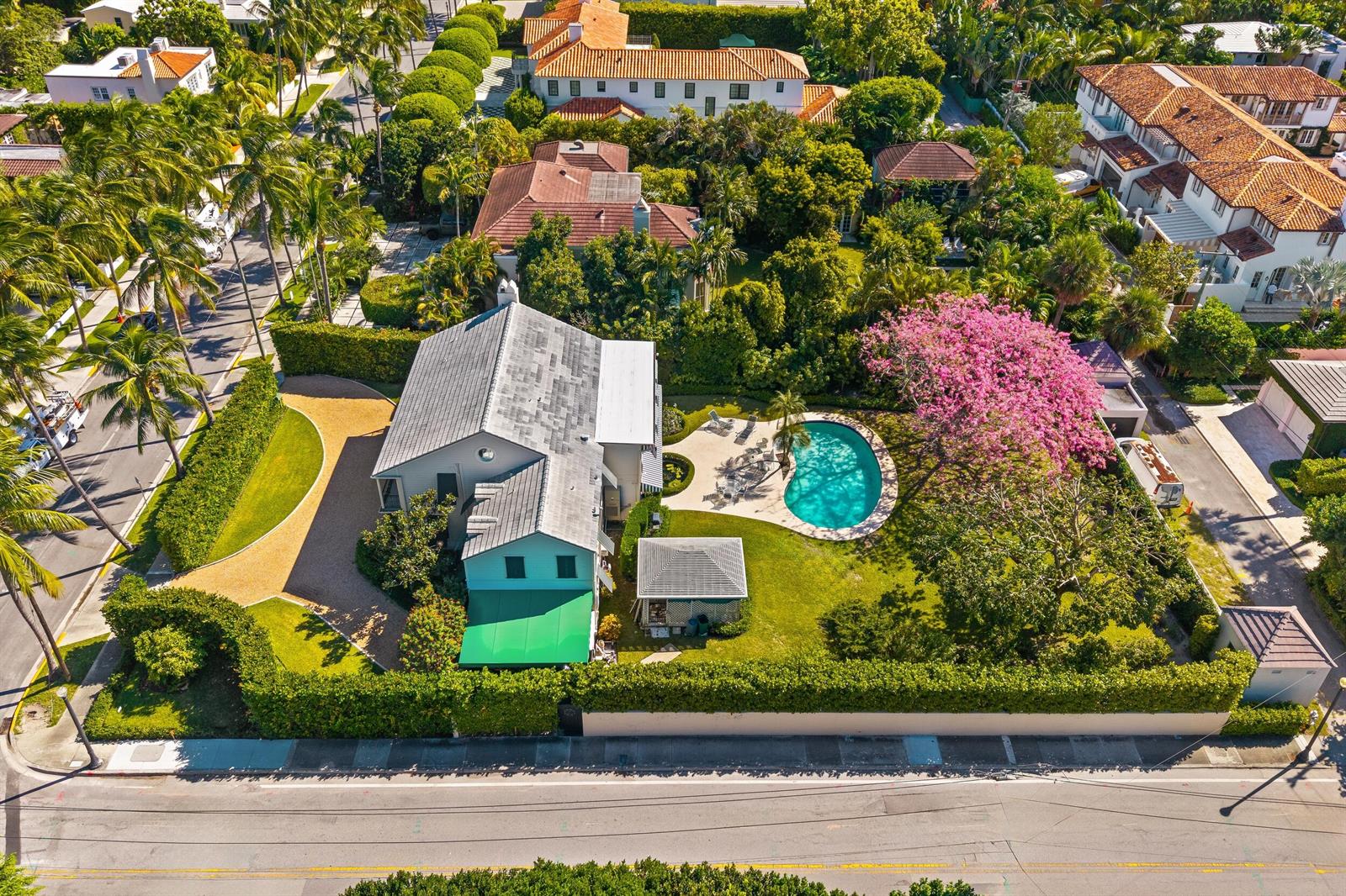 An aerial view of a house with a swimming pool and a large flowering tree — 334 Barton Avenue, Palm Beach FL 33480, PALM BEACH, FL