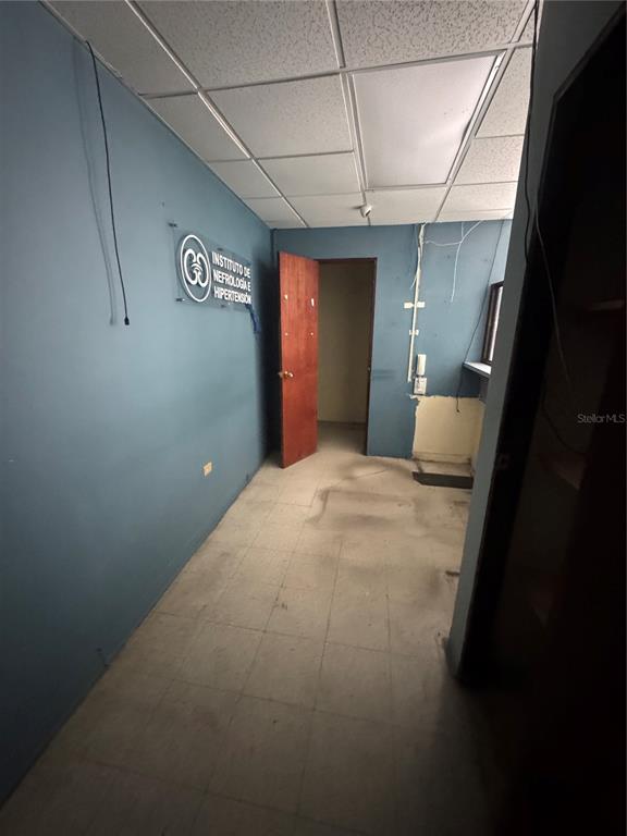 An interior view of a small office space with blue walls and a drop ceiling — Pavia Medical Plaza AMÉRICO SALAS, SAN JUAN, PR