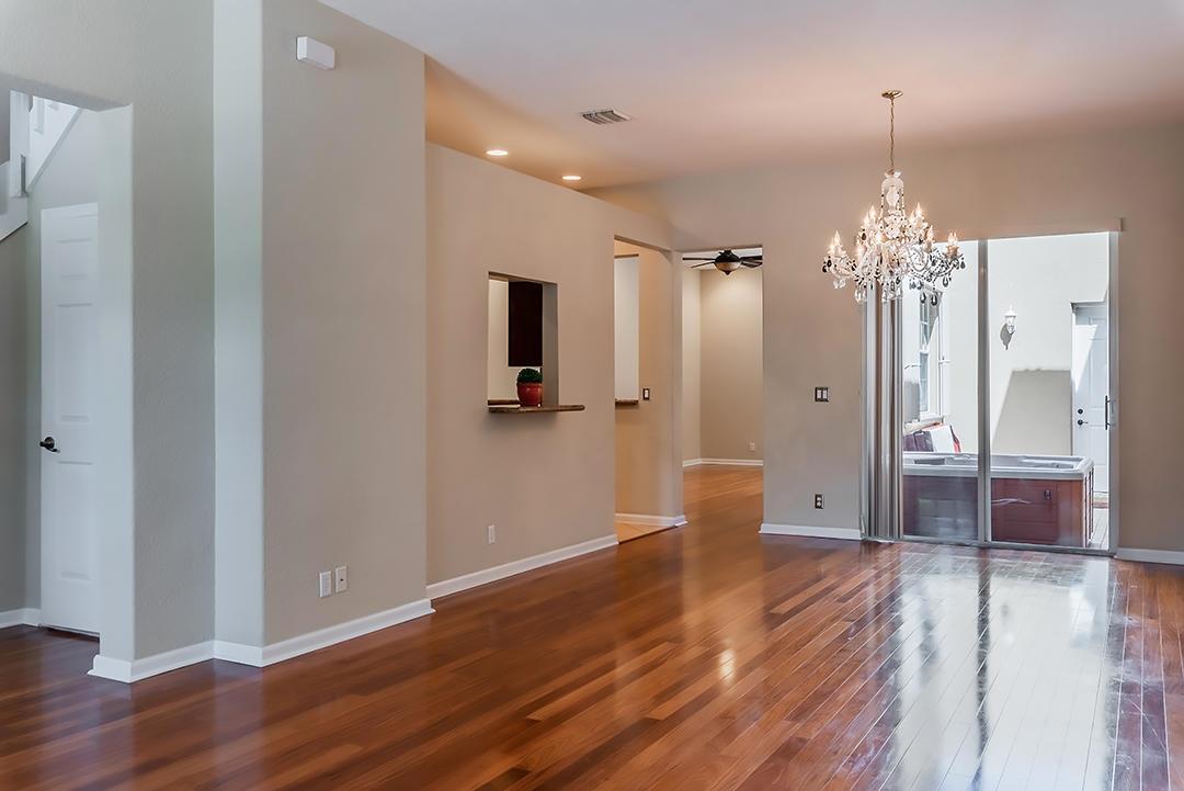 A dining area with hardwood floors, a crystal chandelier, and a sliding glass door — 2502 NW 4th Street, Boynton Beach FL 33426, BOYNTON BEACH, FL