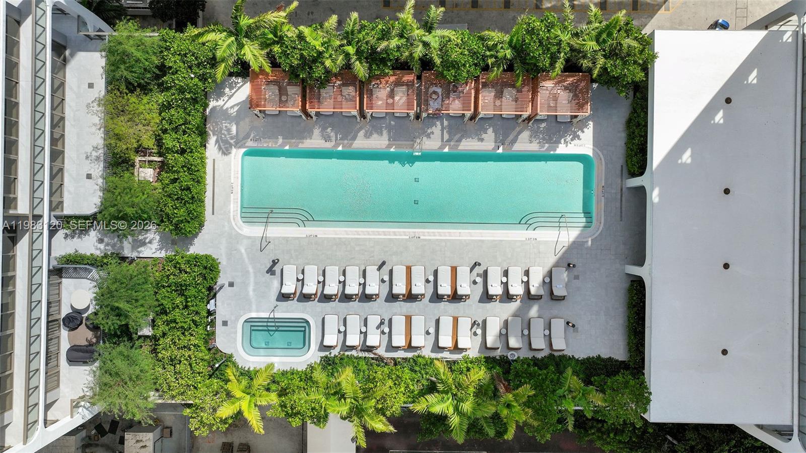 An aerial view shows a rectangular swimming pool, a hot tub, and lounge chairs — 2678 Tigertail Ave # 1705, Miami FL 33133, MIAMI, FL