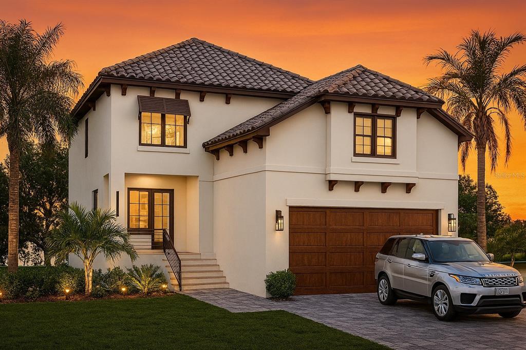 A two-story stucco house with a tile roof, a two-car garage, and a silver SUV — 554 ESTUARY SHORE LANE, APOLLO BEACH, FL