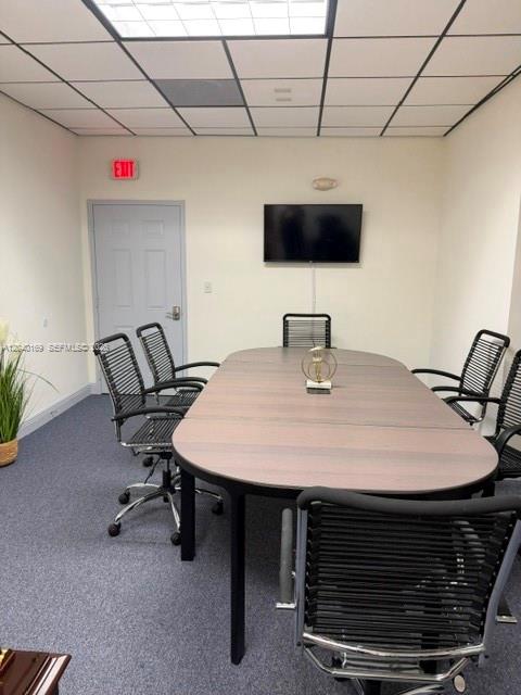 A conference room features a long oval table, several office chairs, and a wall-mounted television — 12150 SW 128th Ct Suite 218, Miami FL 33186, MIAMI, FL