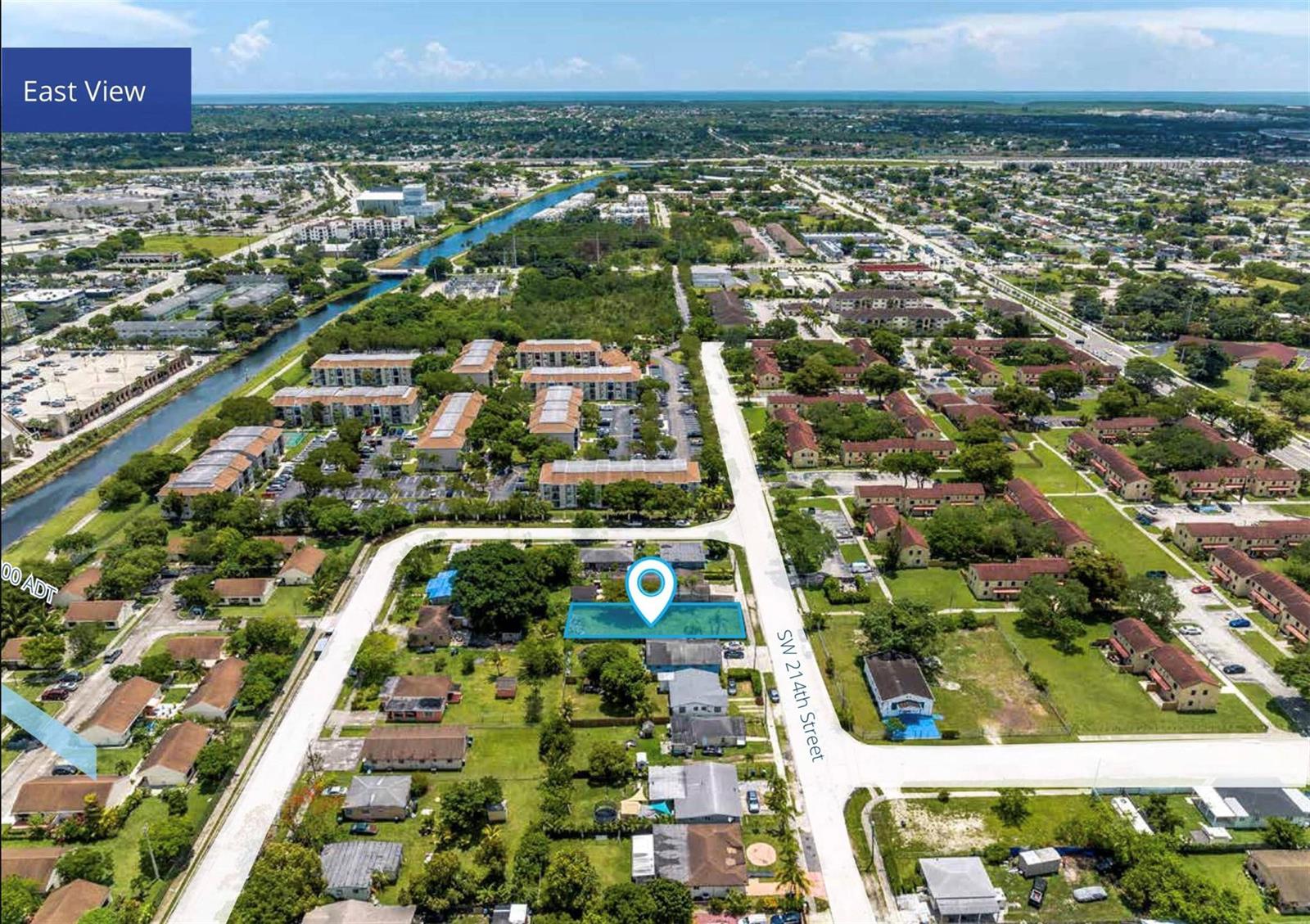 An aerial view shows a highlighted residential lot located along a street in a neighborhood — 11417 SW 214th, Miami FL 33189, MIAMI, FL
