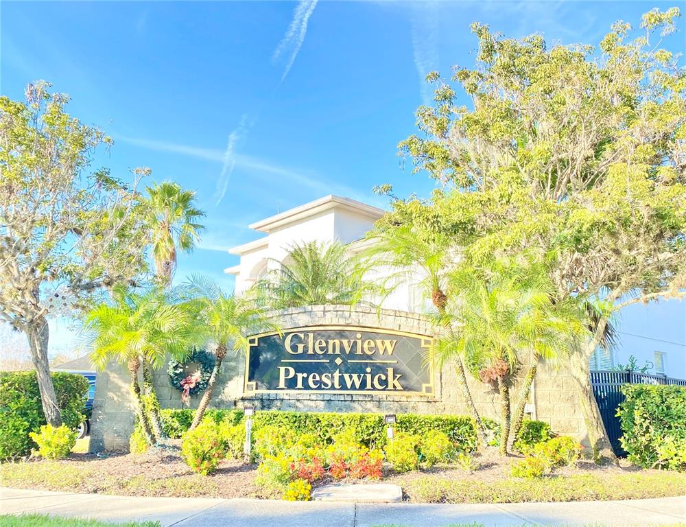 A stone monument sign for Glenview Prestwick stands in front of a house and trees — 729 TUTEN TRAIL, ORLANDO, FL