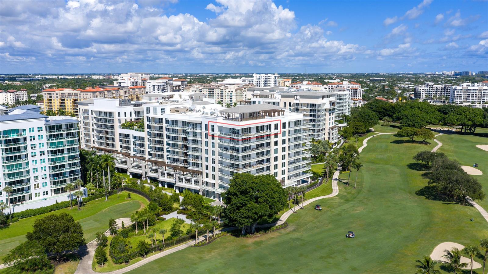 An aerial view of a multi-story apartment building overlooking a golf course — 220 SE Mizner Boulevard # 24, Boca Raton FL 33432, BOCA RATON, FL