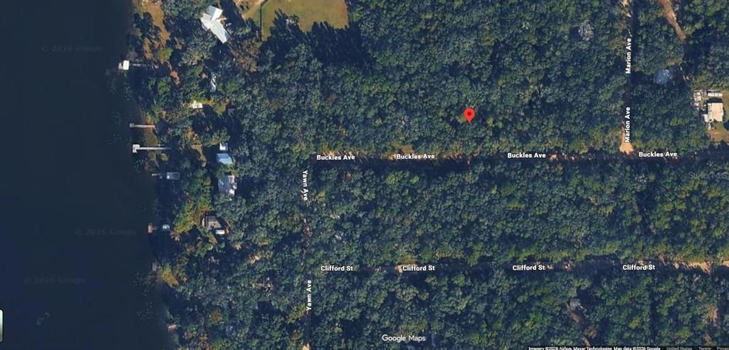 This is an aerial map view of a wooded lot located near a lake — Lot 7, Unit 7, Blk 42 BUCKLES AVENUE, INTERLACHEN, FL