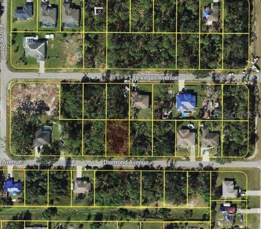 This is an aerial map showing residential lots outlined in yellow along several streets — DIAMOND AVENUE, NORTH PORT, FL