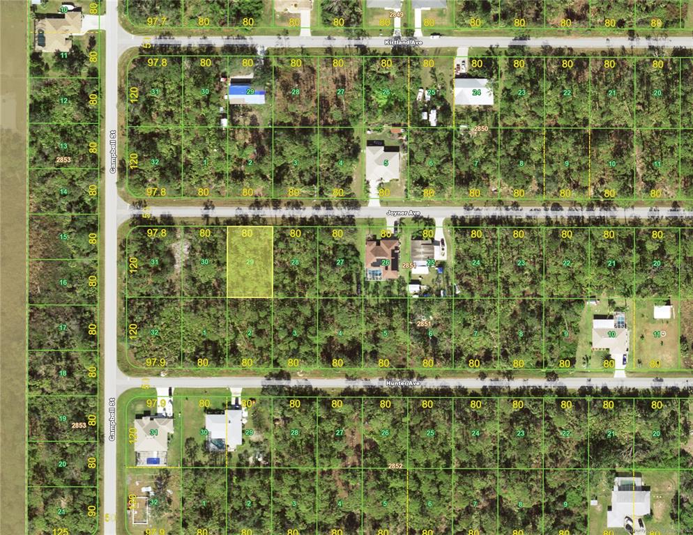 This is a satellite map showing residential land parcels with lot dimensions and street names — 12039 JOYNER AVENUE, PORT CHARLOTTE, FL