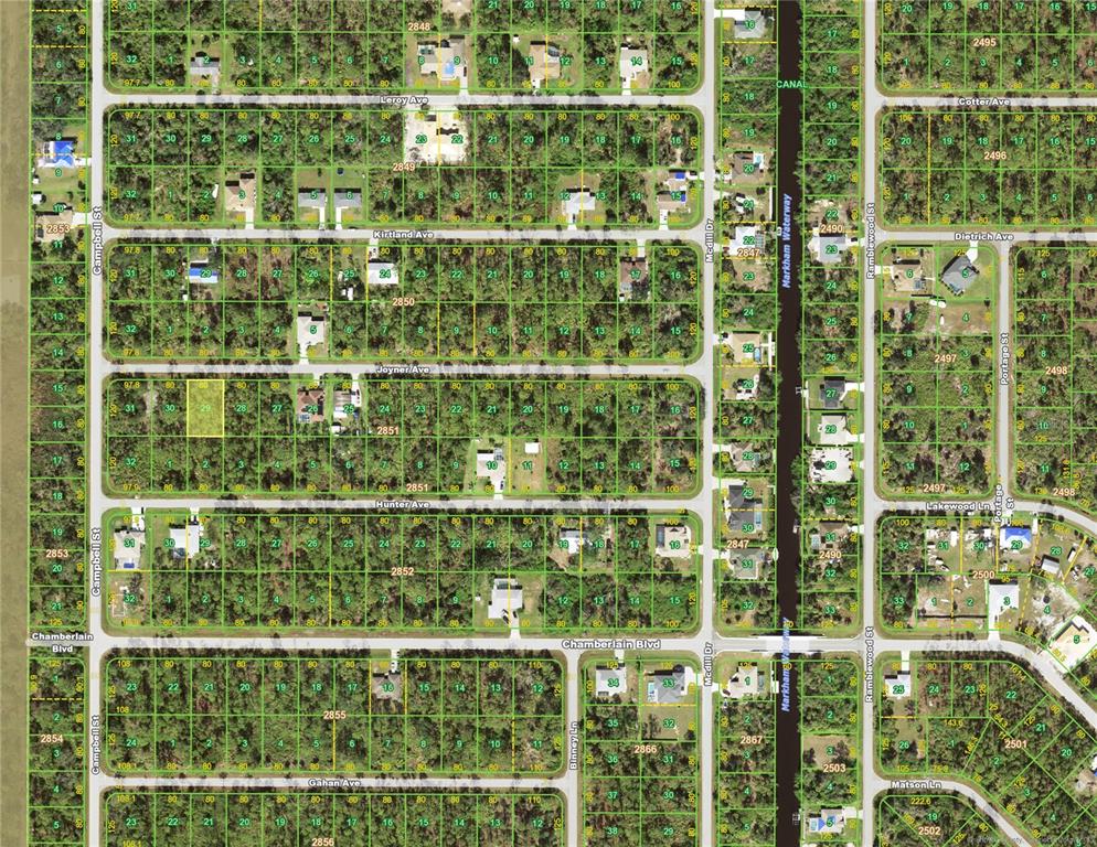 This is an aerial map showing residential lots, streets, and a canal — 12039 JOYNER AVENUE, PORT CHARLOTTE, FL