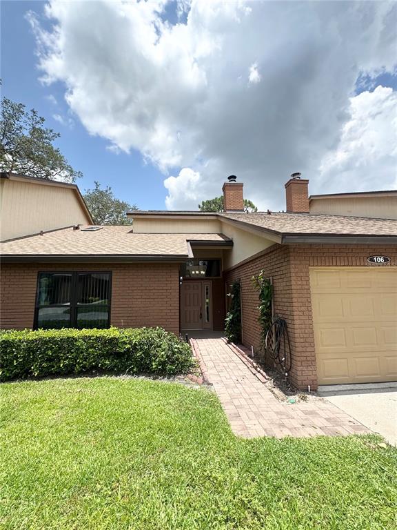 An aerial view shows a residential complex with a swimming pool and a nearby lake — 106 CARLI COURT UNIT 106, LAKE MARY, FL