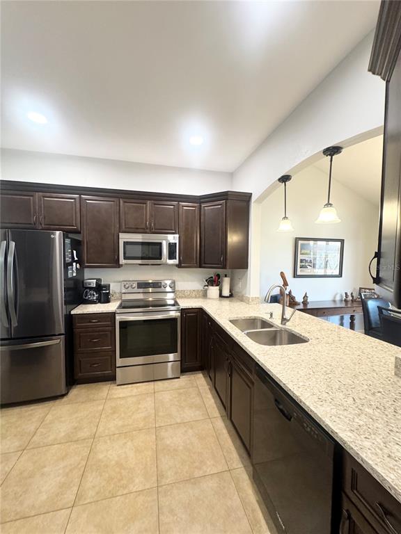An empty room features light wood-look flooring, a ceiling fan, and a window with blinds — 106 CARLI COURT UNIT 106, LAKE MARY, FL