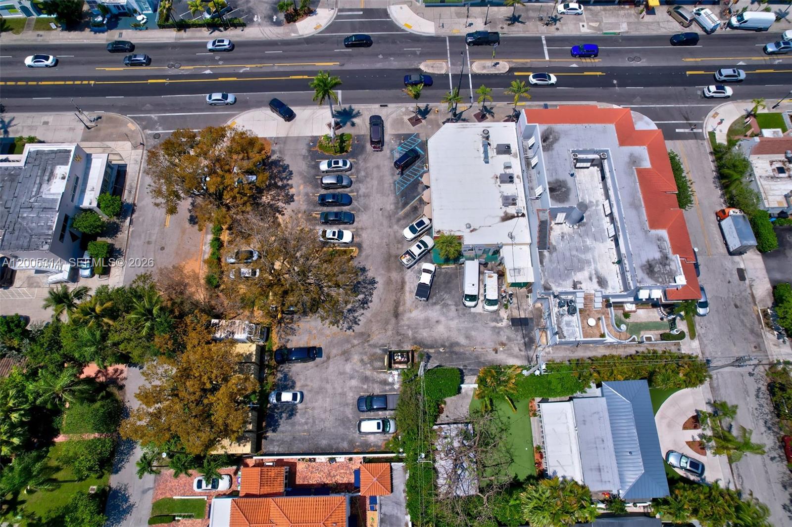 An aerial view shows a commercial building with a parking lot and surrounding streets — 7201 Biscayne Blvd, Miami FL 33138, MIAMI, FL