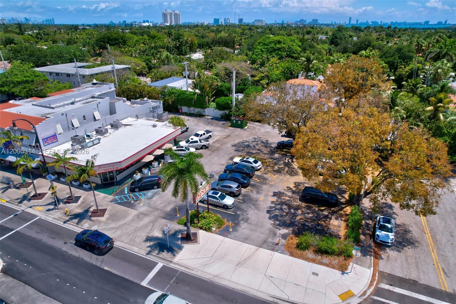 An aerial view shows a diner with an adjacent parking lot and surrounding trees — 7201 Biscayne Blvd, Miami FL 33138, MIAMI, FL
