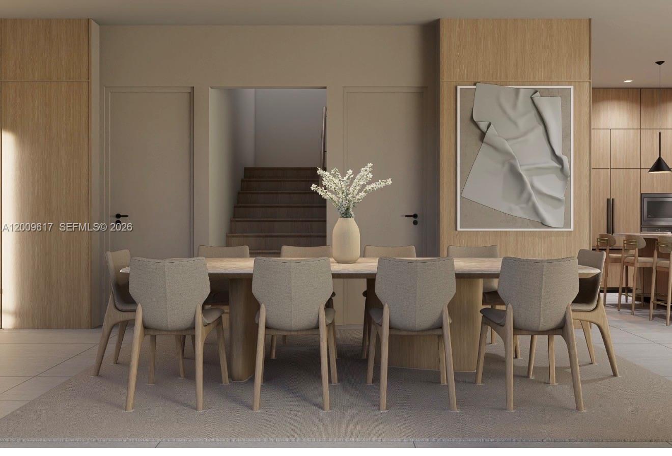 This rendering shows a modern dining room with a long table, upholstered chairs, and wood-paneled walls — 1047 SW 13th Ave # B, Miami FL 33135, MIAMI, FL