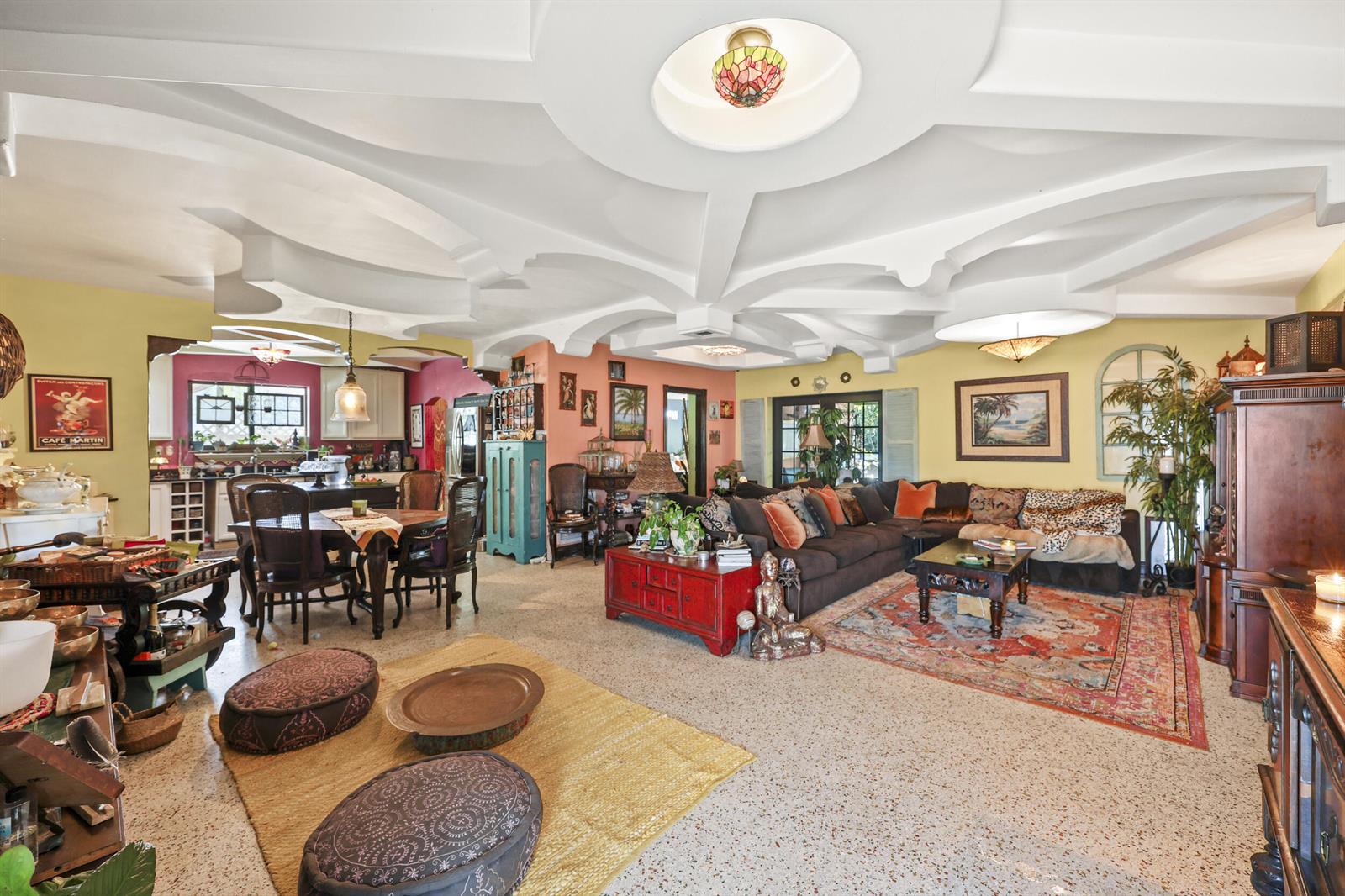 A spacious living and dining area features a unique coffered ceiling and terrazzo flooring — 112 San Juan Drive, Palm Springs FL 33461, PALM SPRINGS, FL
