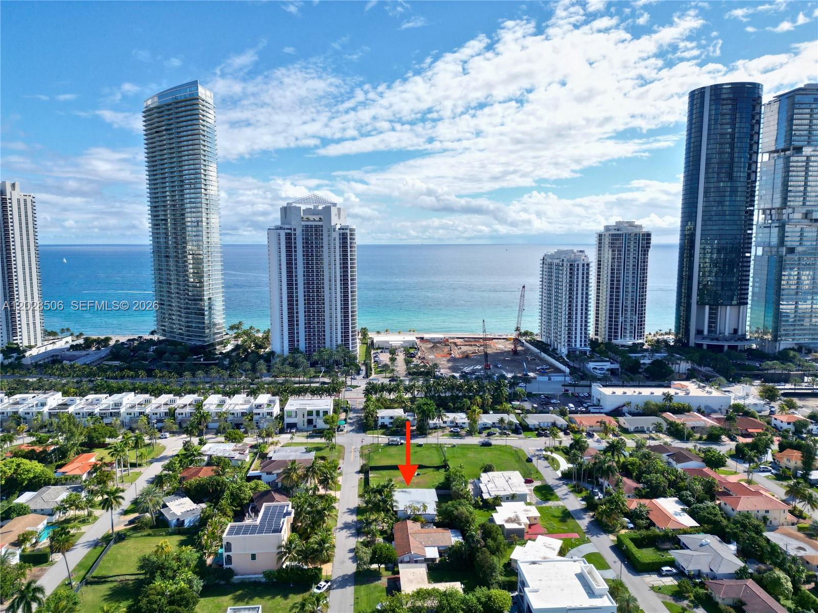 An aerial view shows a residential neighborhood with a red arrow pointing to a house — 212 189th St, Sunny Isles Beach FL 33160, SUNNY ISLES BEACH, FL