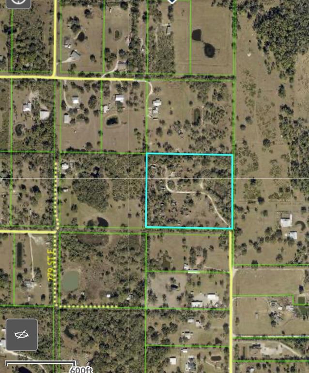 This is an aerial map showing a rectangular property parcel outlined in light blue — 28205 67TH AVENUE E, MYAKKA CITY, FL