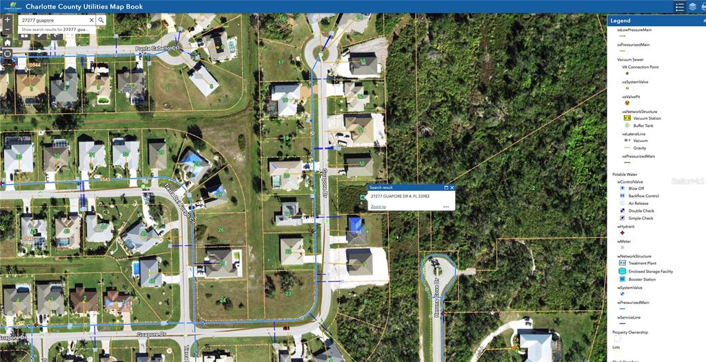 This is a digital map showing utility infrastructure lines overlaid on a residential neighborhood aerial view — 27277 GUAPORE DRIVE, PUNTA GORDA, FL