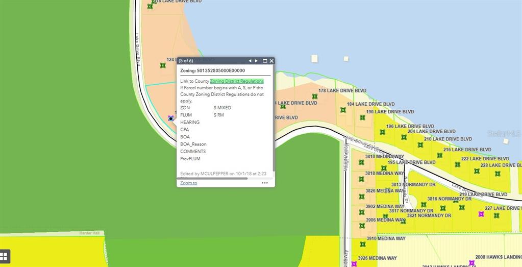 This is a digital map showing property parcel boundaries, street names, and zoning information — 136+142 LAKE DRIVE BOULEVARD, SEBRING, FL