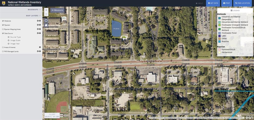 This is a map from the National Wetlands Inventory showing surface waters and wetland areas — 1720 W 1ST STREET, SANFORD, FL