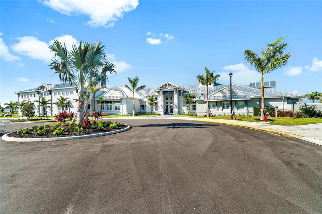 A screened-in patio features a swimming pool, a raised spa, and outdoor lounge furniture — 15859 ISLANDWALK AVENUE, BRADENTON, FL