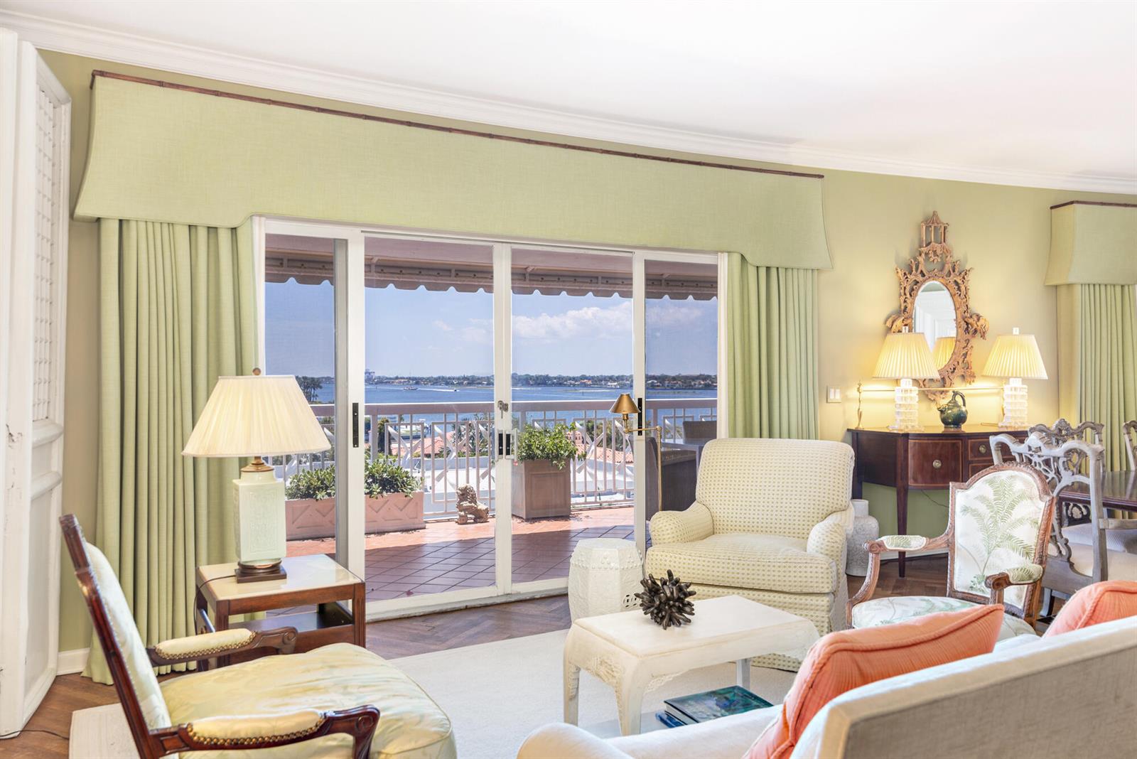 A living room features light green walls, a sliding glass door, and a balcony view — 389 S Lake Drive, Palm Beach FL 33480, PALM BEACH, FL