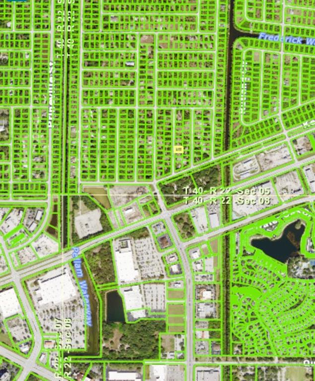 This is a satellite map showing residential lots and commercial areas divided by roads and waterways — 458 ADMIRAL STREET, PORT CHARLOTTE, FL