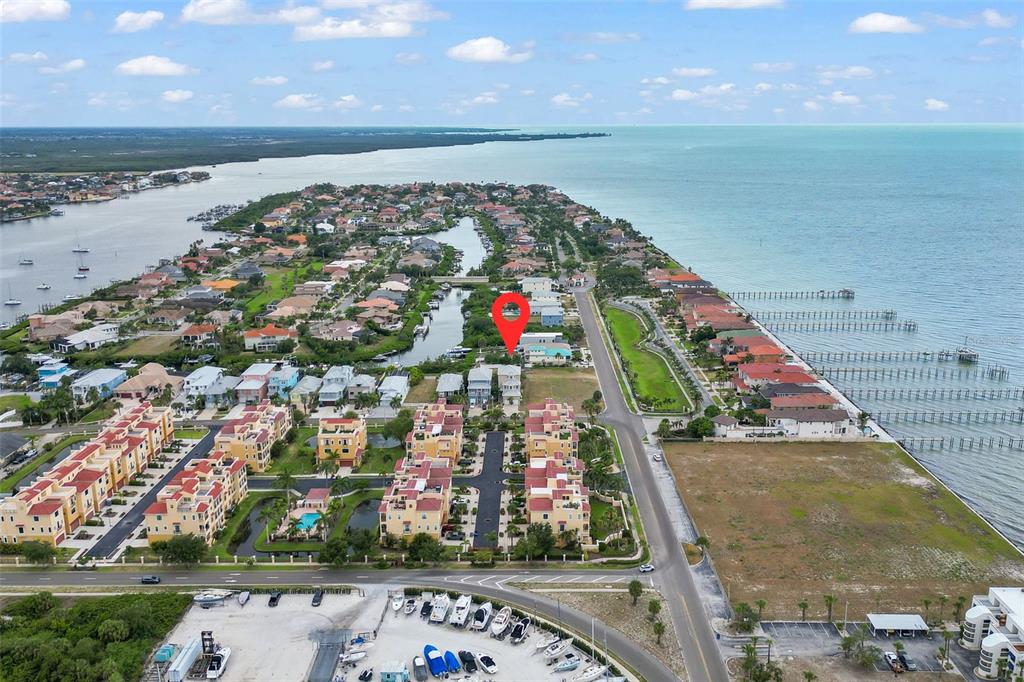 An aerial view shows a coastal residential neighborhood with a red pin marking a house — 1340 APOLLO BEACH BOULEVARD S, APOLLO BEACH, FL