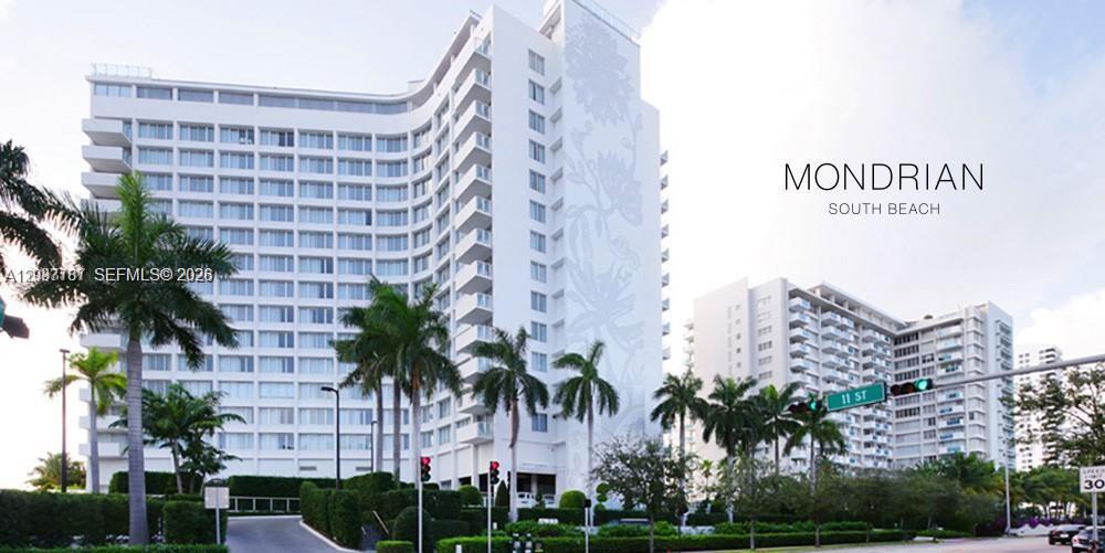 The exterior of the white Mondrian South Beach hotel features palm trees and street signage — 1100 West Ave # 525, Miami Beach FL 33139, MIAMI BEACH, FL