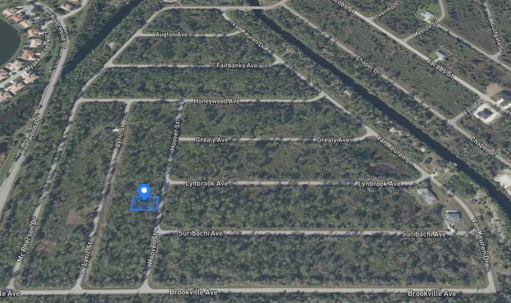 An aerial map view shows a vacant, wooded residential lot highlighted in a suburban neighborhood — 2481 HOOVER STREET, PORT CHARLOTTE, FL