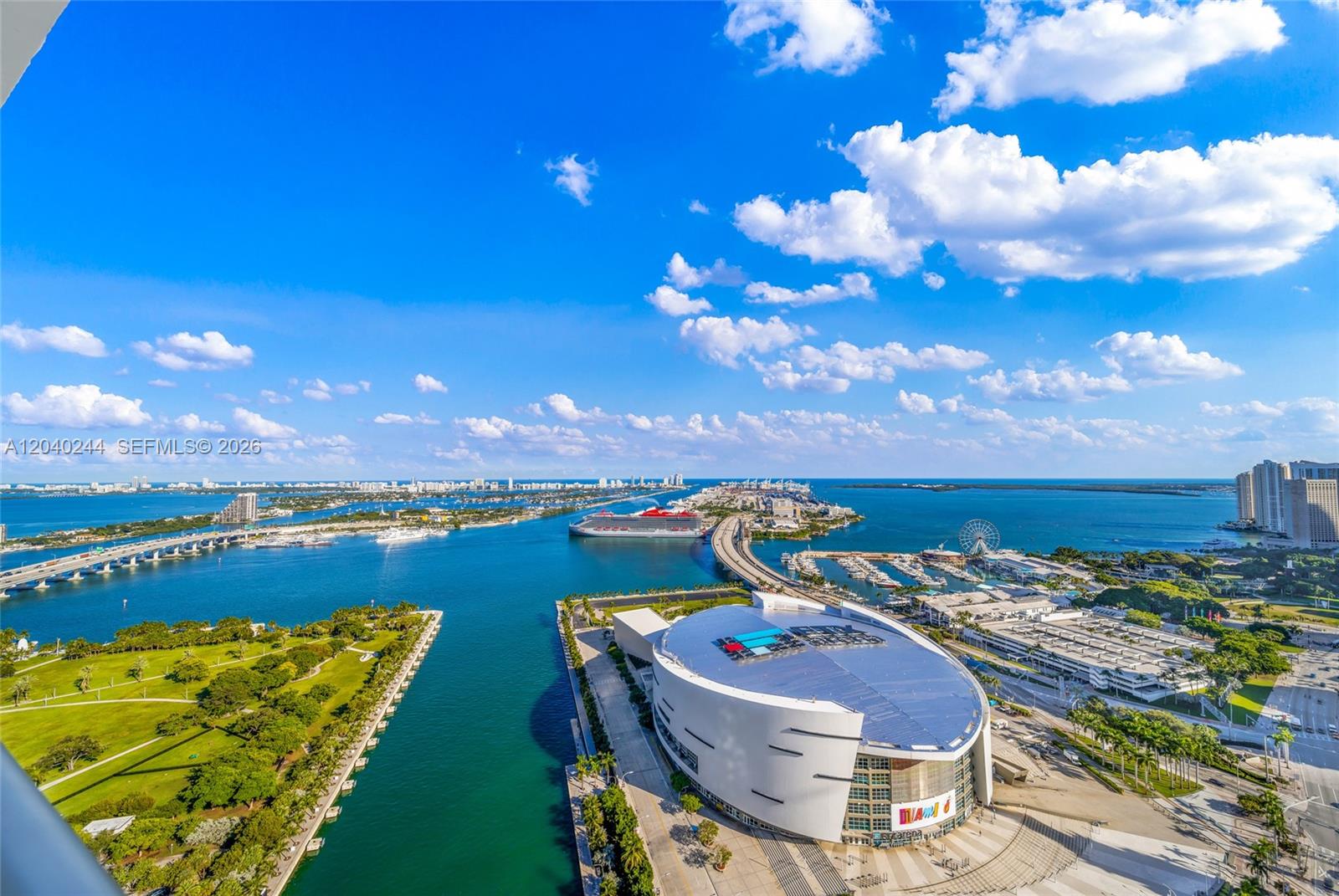 An aerial view shows the Kaseya Center, a cruise ship, and the Miami skyline — 888 Biscayne Blvd # 3907, Miami FL 33132, MIAMI, FL
