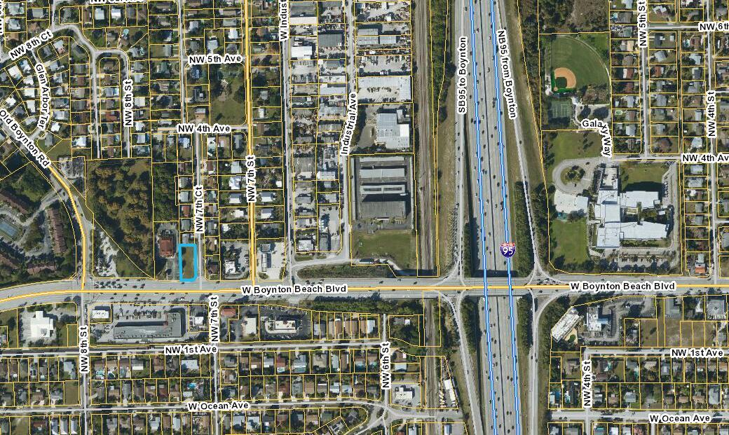 This is an aerial map showing a highlighted rectangular property lot near a highway interchange — 711 W Boynton Beach Boulevard, Boynton Beach FL 33426, BOYNTON BEACH, FL