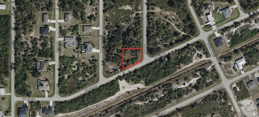 This is an aerial map showing a vacant, irregularly shaped lot outlined in red — 4203 PILGRIM STREET, PORT CHARLOTTE, FL