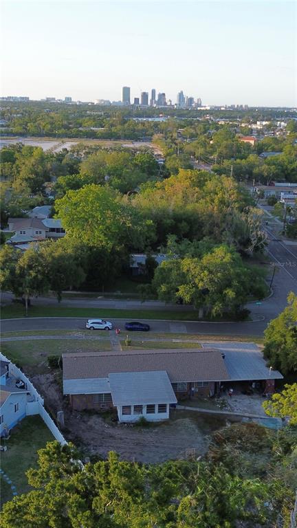 An aerial view shows a single-story house with a carport and a large backyard — 400 LAKE MAGGIORE BOULEVARD S, ST PETERSBURG, FL