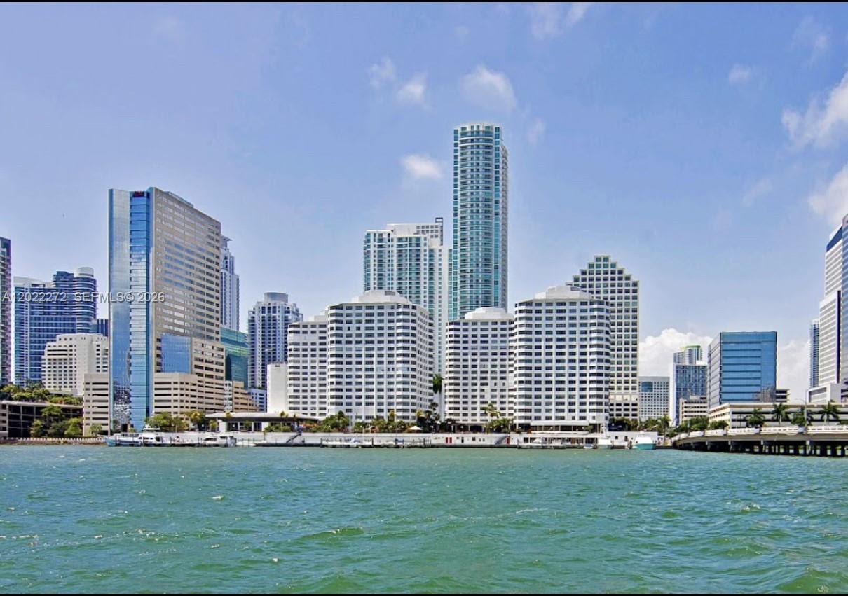 A view of the Miami skyline from the water featuring various high-rise buildings — 999 Brickell Bay Dr # 209, Miami FL 33131, MIAMI, FL