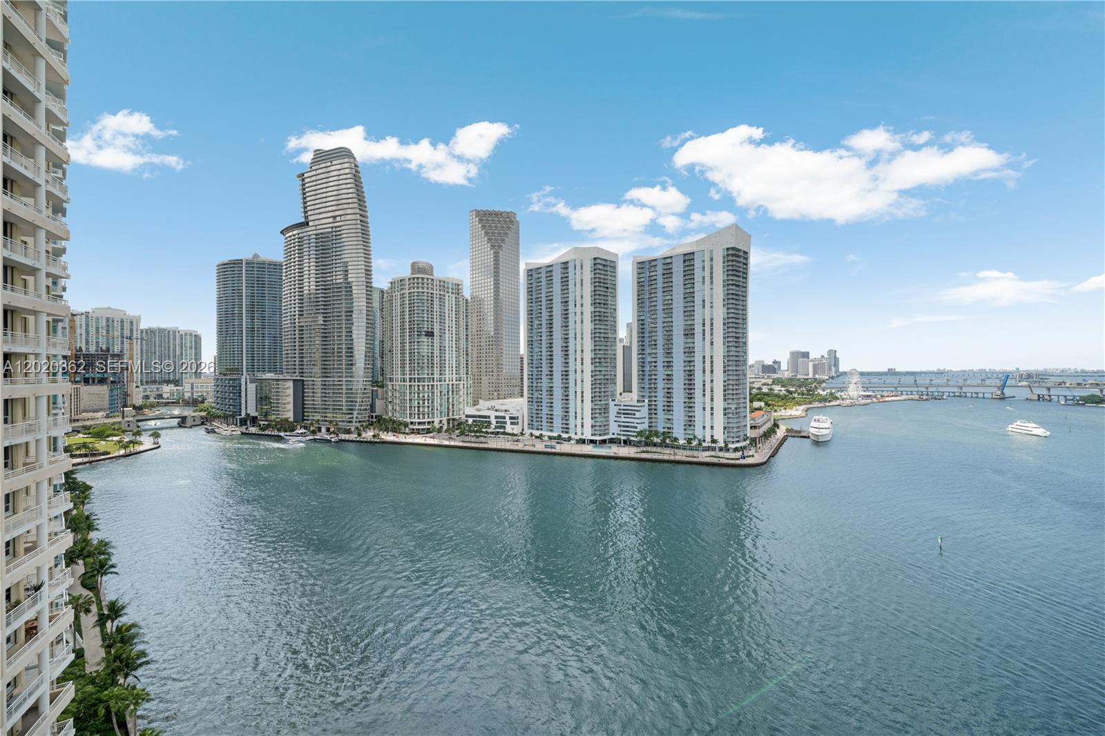 An elevated view of the Miami skyline and waterfront with several high-rise residential buildings — 888 Brickell Key Dr # 1612, Miami FL 33131, MIAMI, FL