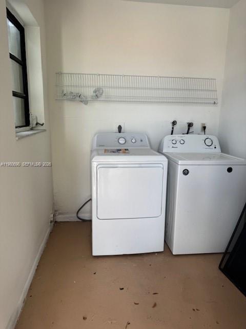 A laundry room features a white dryer and washing machine beneath a wire wall shelf — 13404 SW 62nd St # 101L, Miami FL 33183, MIAMI, FL