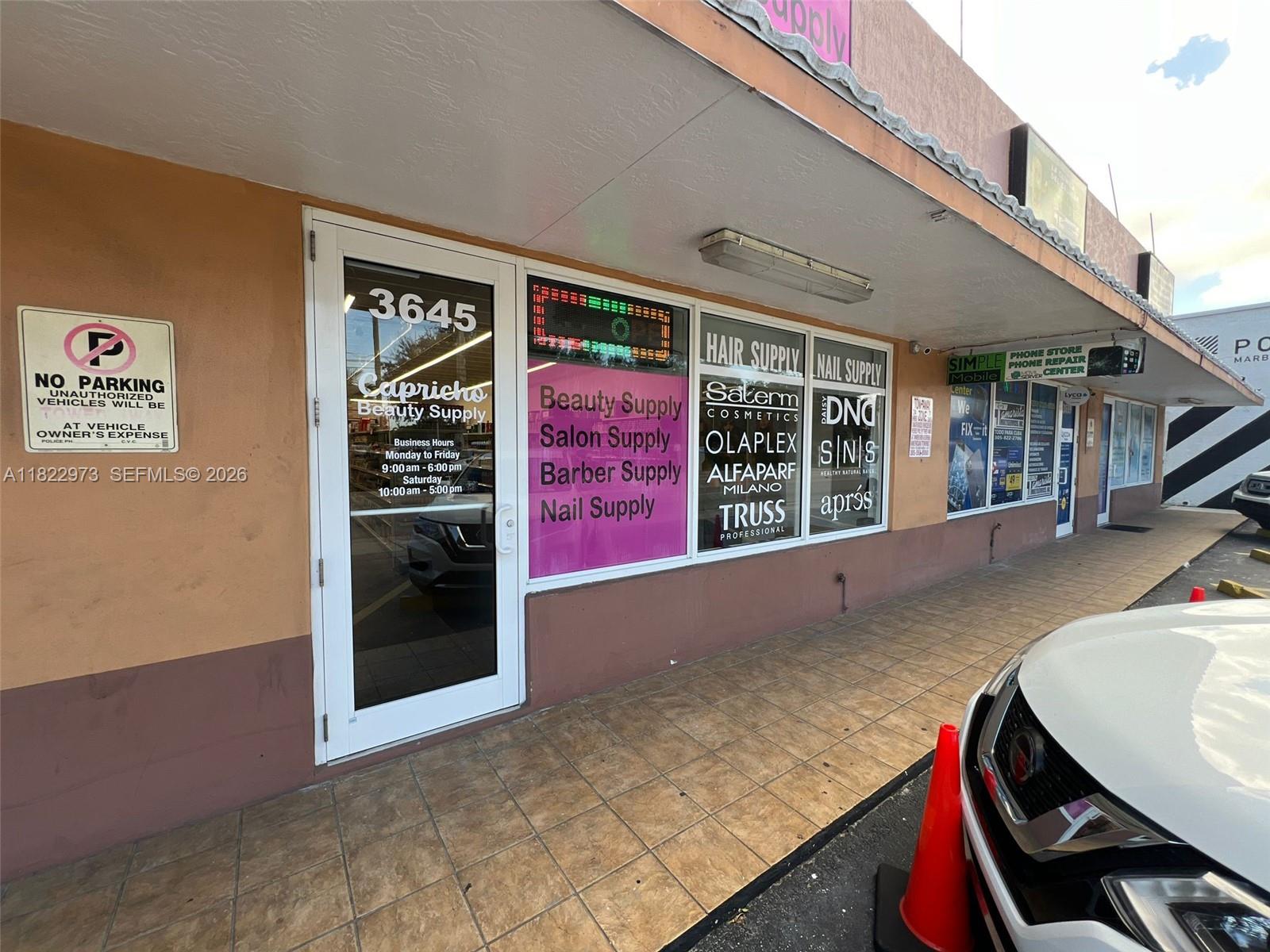 The exterior of a beauty supply store features a glass storefront with signage and hours — 3645 W 16th Ave,, Hialeah FL 33012, HIALEAH, FL