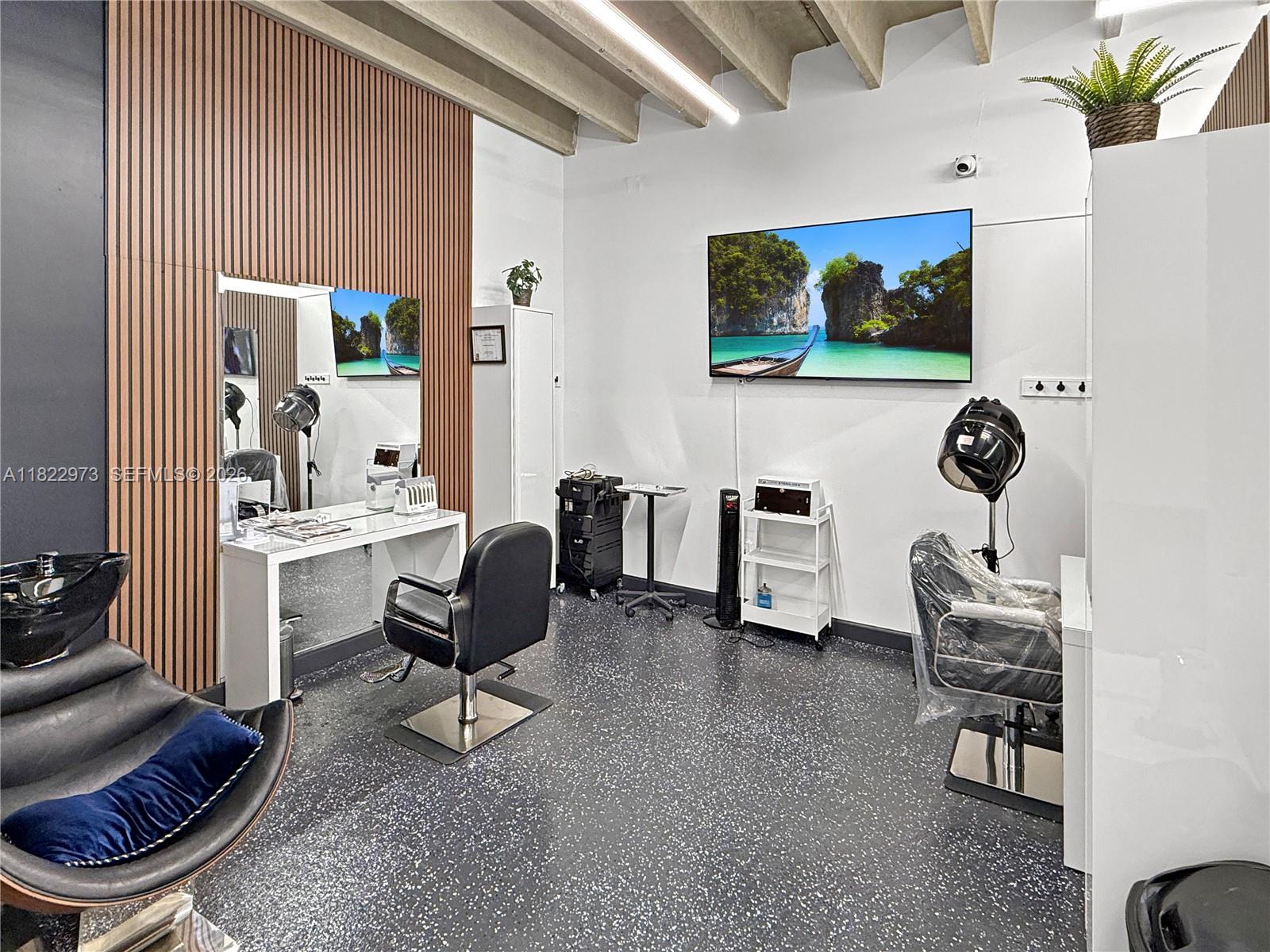 A hair salon features a styling station, a shampoo bowl, and a wall-mounted television — 3645 W 16th Ave,, Hialeah FL 33012, HIALEAH, FL