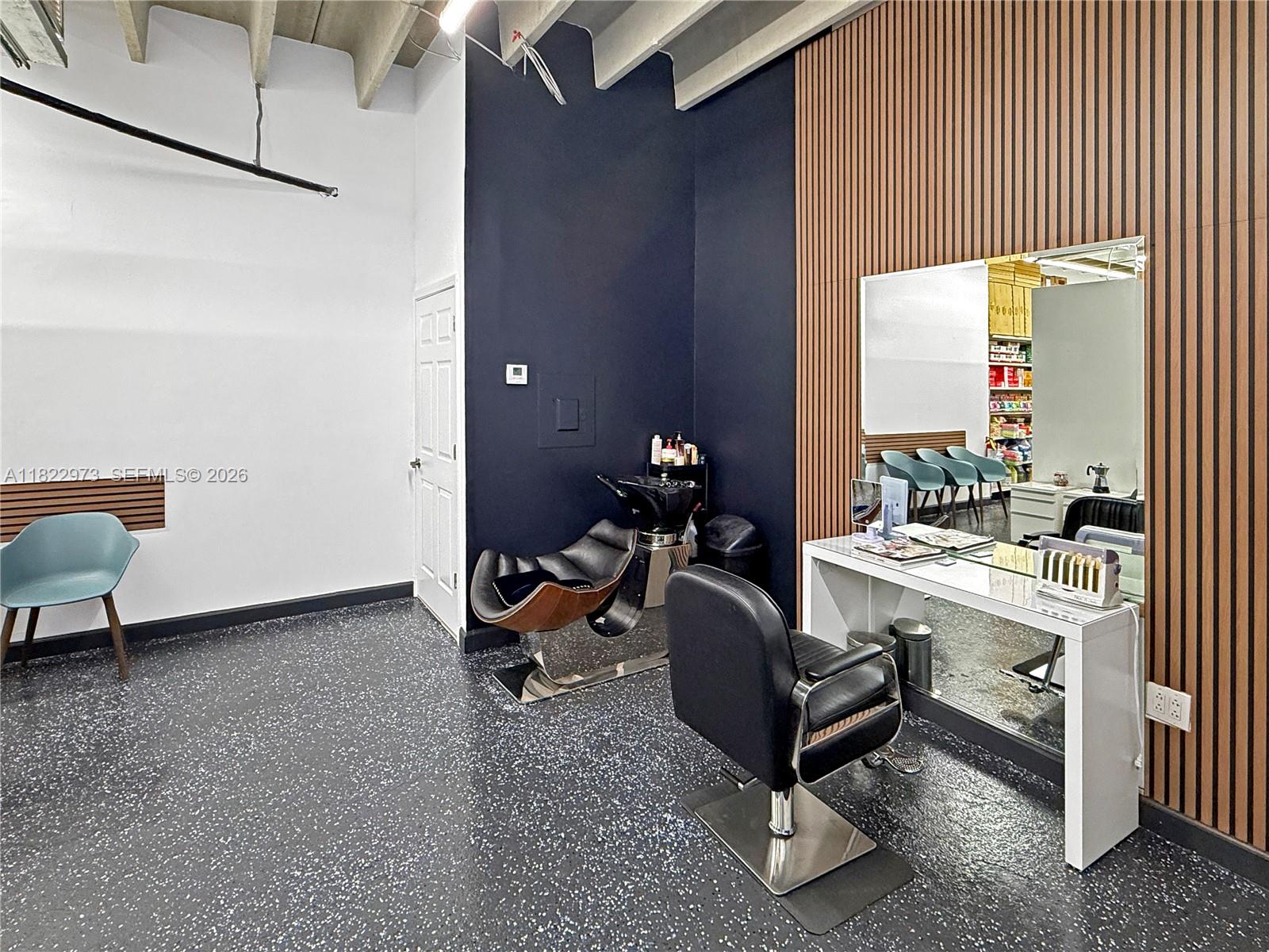 A hair salon features a styling station, a shampoo chair, and wood-slatted accent walls — 3645 W 16th Ave,, Hialeah FL 33012, HIALEAH, FL