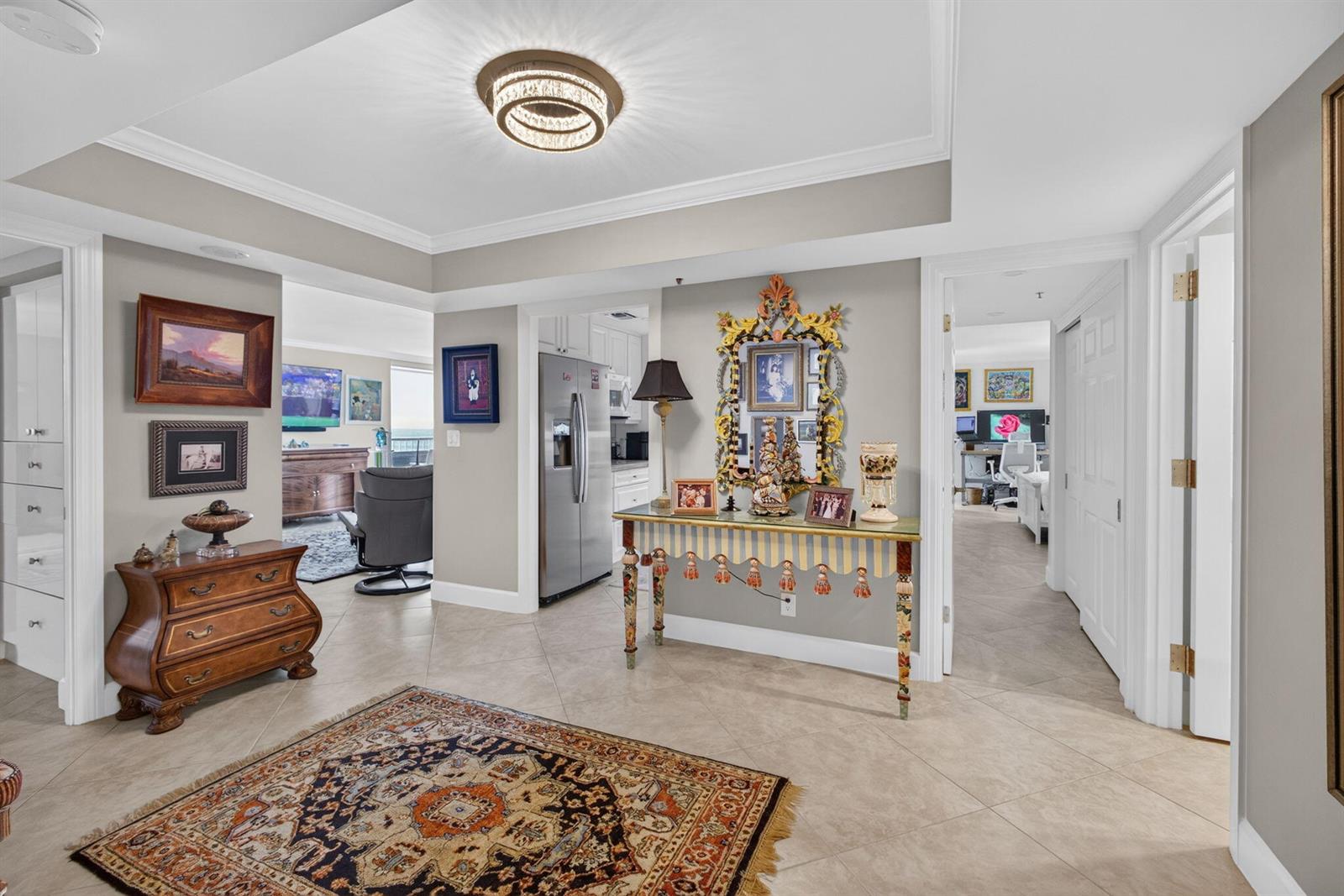 A foyer with tile flooring, an ornate console table, and a decorative rug — 5280 N Ocean Drive # 3a, Singer Island FL 33404, SINGER ISLAND, FL