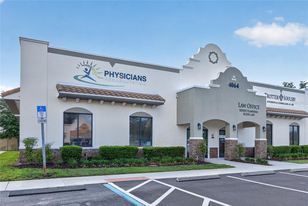 A commercial building exterior features a Physicians Rehabilitation office and a law firm — 4064 E STATE ROAD 44, WILDWOOD, FL