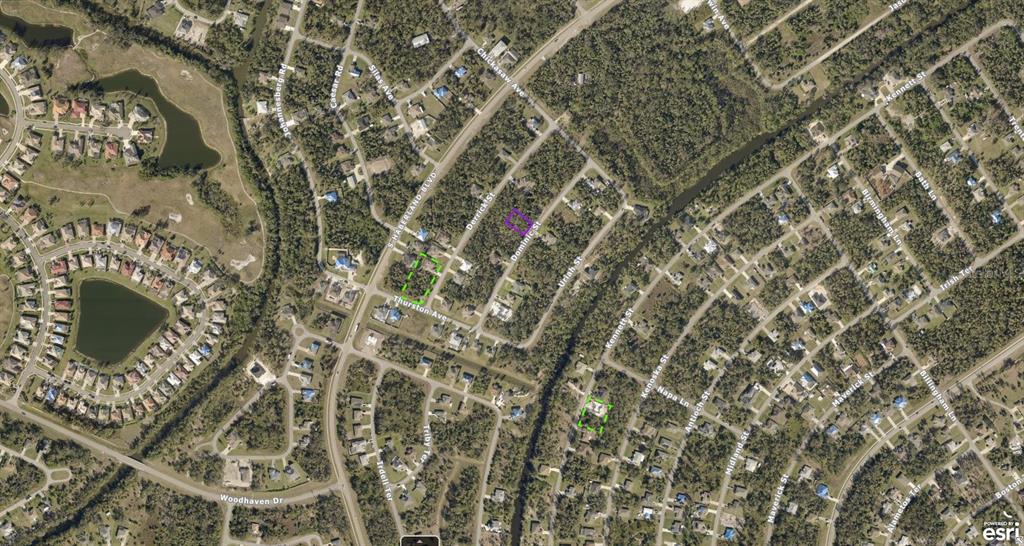 This is an aerial map showing residential streets and properties with two highlighted lots — 1143177106 DOMINIC STREET, NORTH PORT, FL