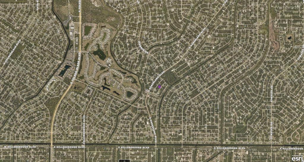 This is an aerial map view of a residential neighborhood with winding streets and houses — 1143177106 DOMINIC STREET, NORTH PORT, FL