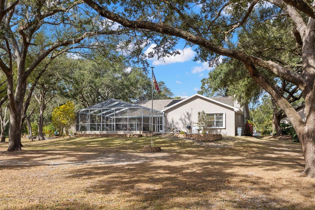 This floor plan shows a single-story house with a garage, swimming pool, and screened porch — 3734 THORNBUSH LANE, NEW PORT RICHEY, FL