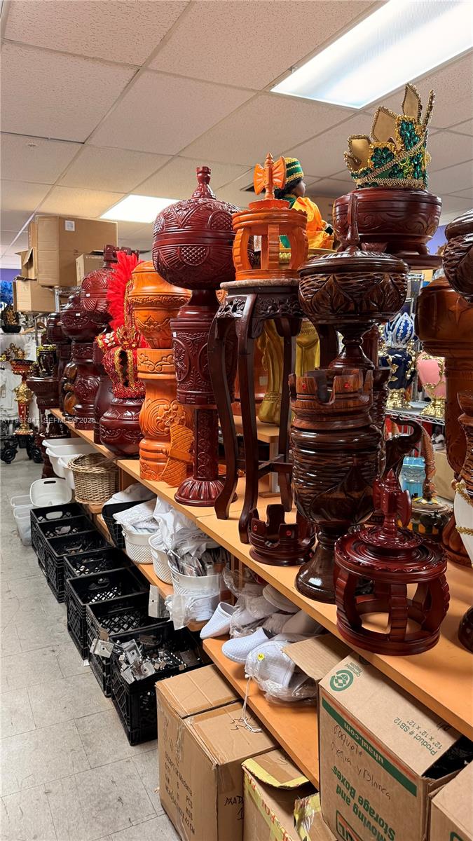 Shelves in a storage room are filled with various decorative wooden urns and containers — 1580 W 37 St, Hialeah FL 33012, HIALEAH, FL