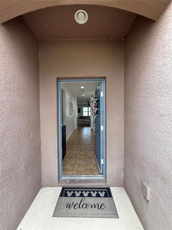 A view through an open front door into a home with tile flooring — 759 SUGAR CAMP WAY, BROOKSVILLE, FL