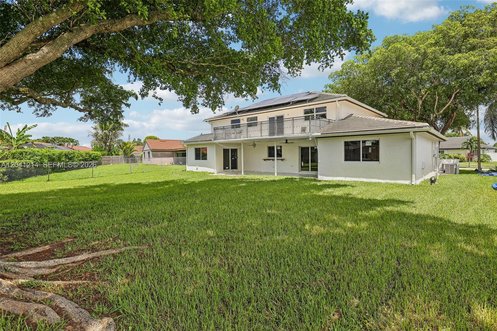 A set of tiled stairs leads to a double glass door entrance under an archway — 15010 E Falcons Lea Dr, Davie FL 33331, DAVIE, FL