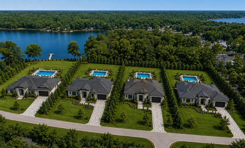 An aerial view shows four luxury houses with swimming pools situated along a lakefront — 1444 CHESAPEAKE DRIVE, ODESSA, FL