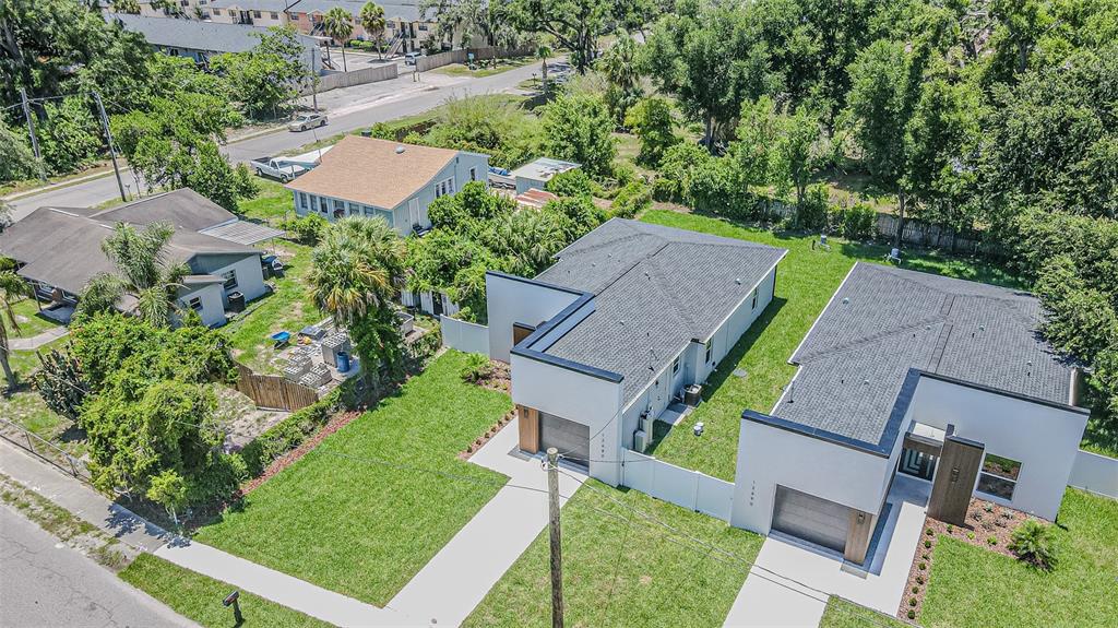 An aerial view of two modern white houses with gray roofs and attached garages — 12680 N CENTRAL AVENUE, TAMPA, FL